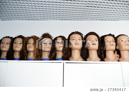 A row of dummies for the hairdresser A row of dummies for the hairdresser 27393417