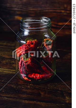 Dry Red Chili Peppers inside the Jar. Dry Red Chili Peppers inside the Jar. 27394623