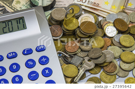 Mortgage concept focused on the coins, money keys Mortgage concept focused on the coins, money keys 27395642