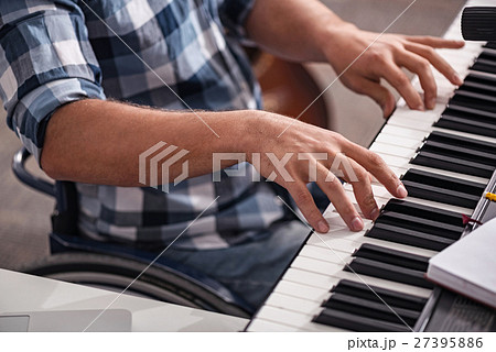 Creative disabled person playing piano Creative disabled person playing piano 27395886