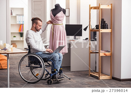 Committed tailor comparing measurements 27396014