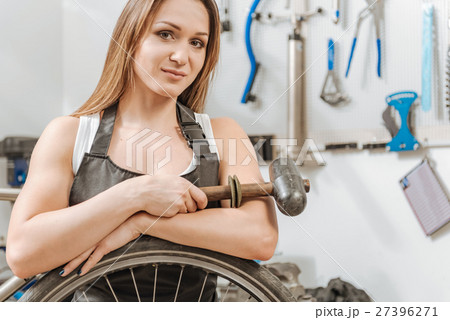 Pleasant craftswoman standing in the workshop 27396271