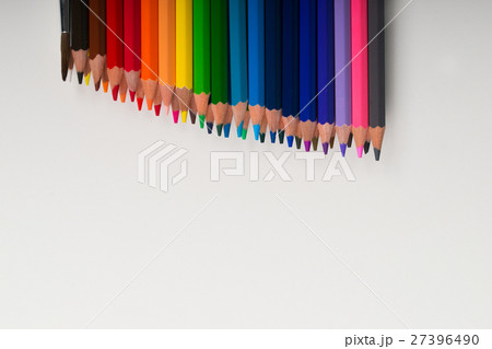 Multicolored pensils on the white paper. Back to 27396490