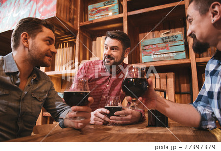 Cheerful pleasant men resting together 27397379
