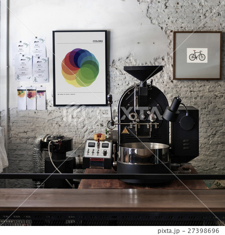 Coffee roaster with photo frames on the wall 27398696