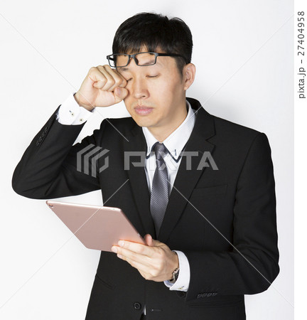Exhausted Businessman with tablet Exhausted Businessman with tablet 27404958