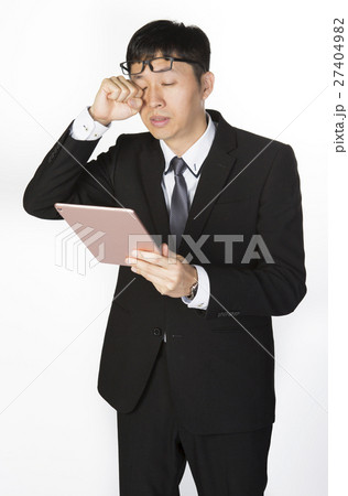 Exhausted Businessman with tablet Exhausted Businessman with tablet 27404982