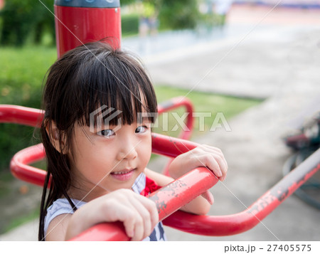 Happy asian baby child playing on playground Happy asian baby child playing on playground 27405575