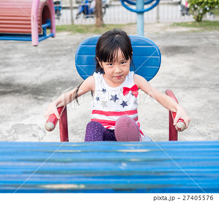 Happy asian baby child playing on playground Happy asian baby child playing on playground 27405576