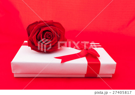 Valentines gift box with a red bow on red Valentines gift box with a red bow on red 27405817