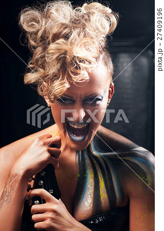 Aggressive punk woman screaming at camera Aggressive punk woman screaming at camera 27409196