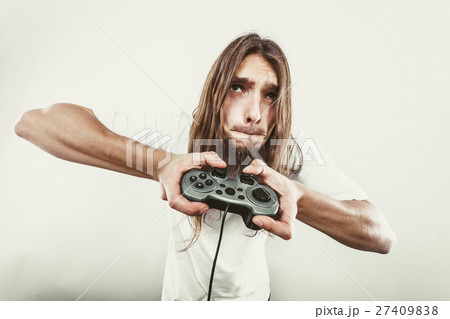 Male player focus on play games Male player focus on play games 27409838