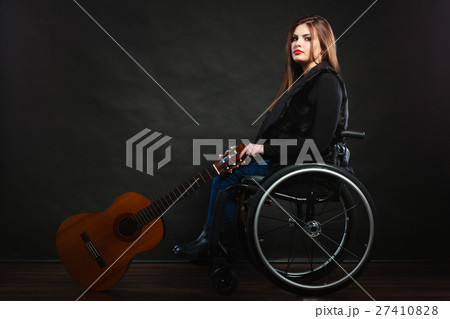 Sad disabled girl with guitar. Sad disabled girl with guitar. 27410828