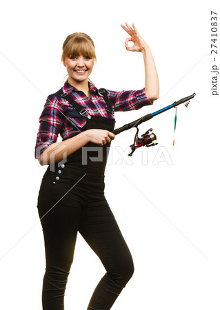 Woman with fishing rod showing a ok 27410837