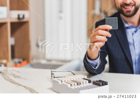 Successful businessman selling objects for Successful businessman selling objects for 27411023