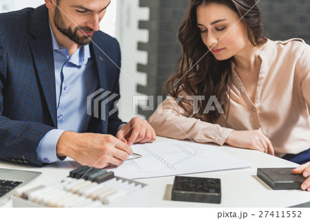 Man is presenting his ideas about design of 27411552