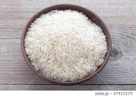 rice on a wooden background 27413275