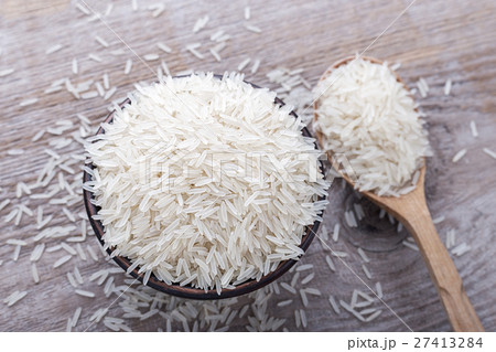 rice on a wooden background 27413284