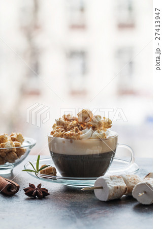 Glass of coffee with popcorn Glass of coffee with popcorn 27413947