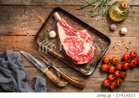 Raw tomahawk beef steak 27414025