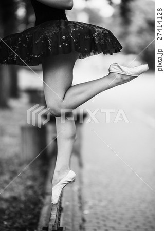 Ballerina posing in the center city 27414128