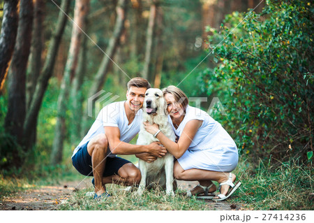 Happy couple of future parents with pet Happy couple of future parents with pet 27414236