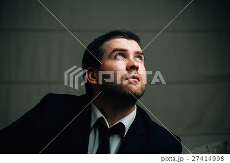 businessman looks up the light 27414998