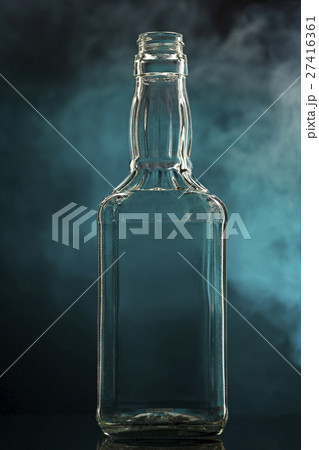 Empty colorless glass bottle 27416361