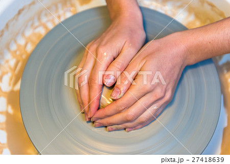 womens hands of a potter creating an earthen jar womens hands of a potter creating an earthen jar 27418639