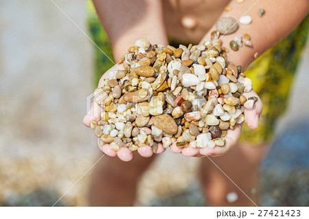 Child hands with pebbles Child hands with pebbles 27421423