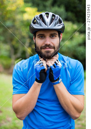 Male athletic wearing bicycle helmet Male athletic wearing bicycle helmet 27425943