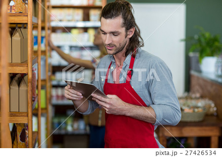 Male staff using a digital tablet 27426534