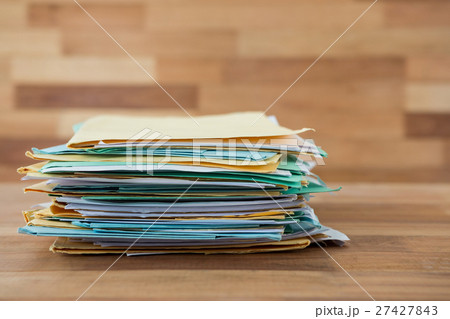 Stack of files on table 27427843
