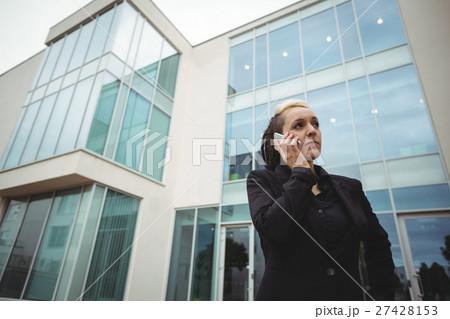 Businesswoman talking on mobile phone Businesswoman talking on mobile phone 27428153