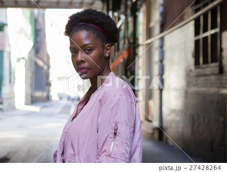 Portrait of young black woman in dark city street 27428264