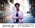 Portrait of young black woman on city street 27428273