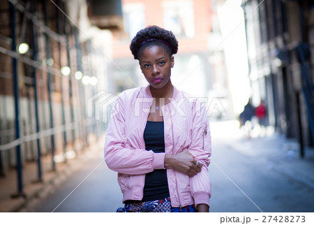 Portrait of young black woman on city street 27428273