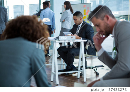 Businessman using digital tablet in the office 27428278