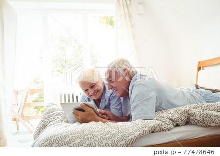 Senior couple using digital tablet 27428646