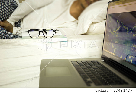 Businessman sleeping while working with notebook 27431477