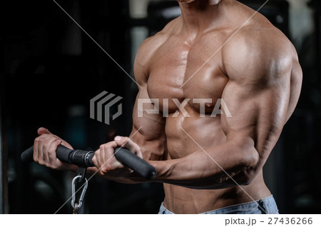 Strong and handsome athletic young man muscles abs 27436266