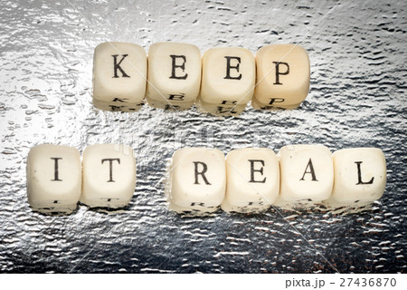 Keep it real text on a wooden cubes 27436870