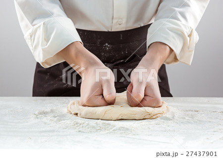 Hands kneading a dough 27437901