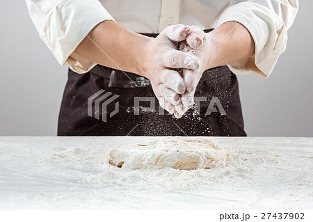 Hands kneading a dough 27437902