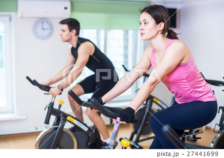 Group training people biking in the gym Group training people biking in the gym 27441699