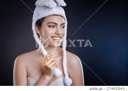 Posiive woman posing in funny hat Posiive woman posing in funny hat 27442041