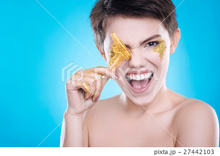 Cheerful woman having fun on blue background Cheerful woman having fun on blue background 27442103