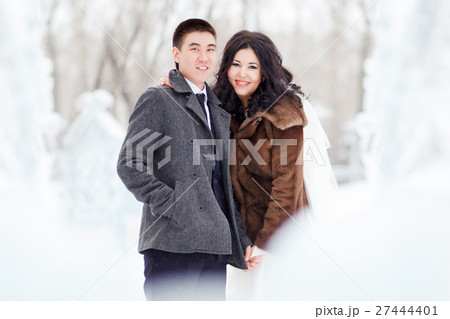 Winter wedding, the bride with veil, groom in 27444401