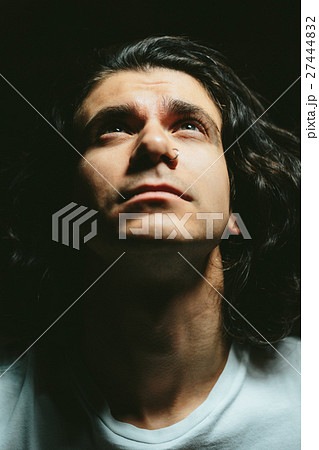 Portrait of a handsome young man with long hair Portrait of a handsome young man with long hair 27444832