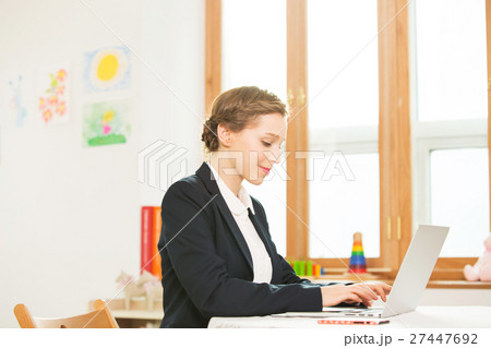 Foreign Female Teacher At Her Desk 27447692